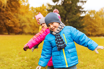 Image showing group of happy children having fun in autumn park