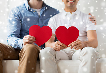 Image showing close up of happy gay male couple with red hearts