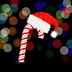 Image showing Candy Cane and Hat of Santa Claus