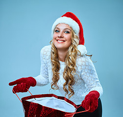 Image showing Beautiful young woman in Santa Claus clothes