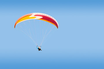 Image showing Tandem paraglider free gliding in deep blue sky