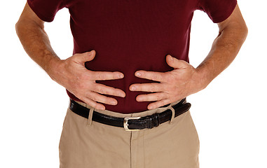 Image showing Man holding his stomach for pain.