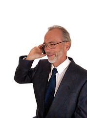 Image showing Happy businessman on cell phone.