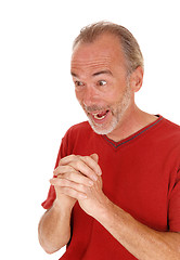 Image showing Exited older man hands folded.