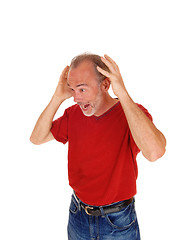 Image showing Old man scared with hands on head.