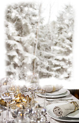 Image showing Christmas dinner in front of winter forest