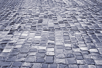 Image showing Road with wet cobblestones in rainy weather