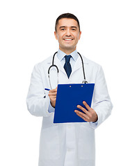 Image showing smiling male doctor with clipboard and stethoscope