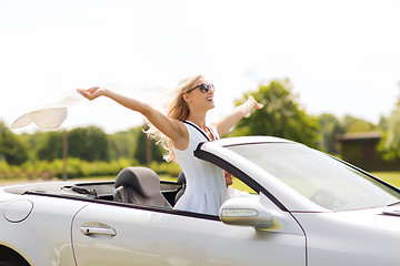 Image showing happy man and woman driving in cabriolet car