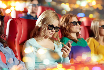 Image showing happy woman with smartphone in 3d movie theater