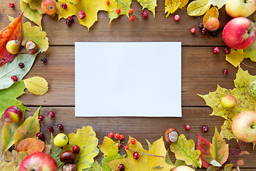 Image showing close up of paper with autumn leaves and fruits