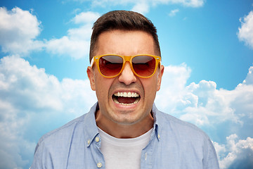 Image showing face of angry man in shirt and sunglasses