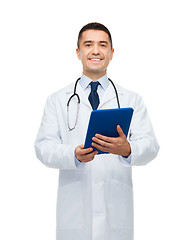 Image showing smiling male doctor in white coat with tablet pc