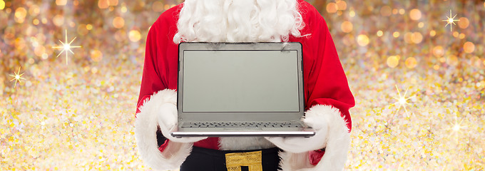 Image showing close up of santa claus with laptop