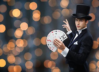 Image showing magician showing trick with playing cards