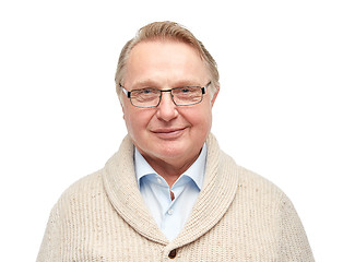 Image showing smiling senior man in cardigan