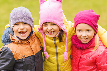 Image showing group of happy children hugging in autumn park