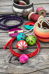 Image showing beads on wooden background