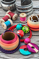 Image showing beads on wooden background