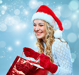 Image showing Beautiful young woman in Santa Claus clothes