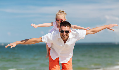 Image showing happy family having fun on summer beach