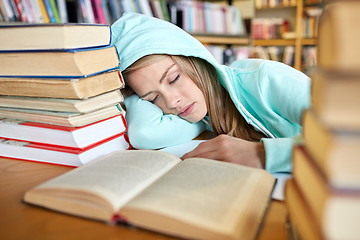 Image showing student or woman with books sleeping in library