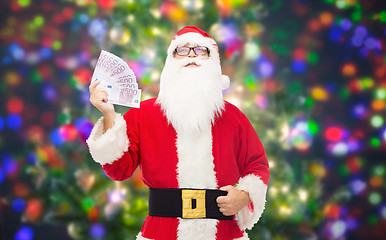 Image showing man in costume of santa claus with euro money