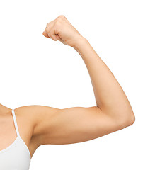 Image showing sporty woman flexing her biceps