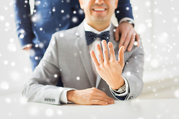 Image showing close up of male gay couple with wedding rings on