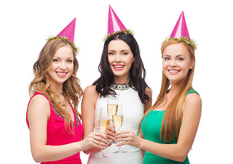 Image showing three women in pink hats with champagne glasses