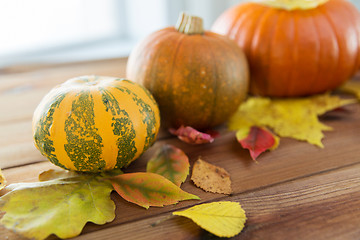 Image showing close up of pumpkins on wooden table at home