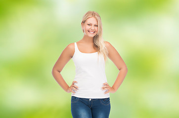 Image showing smiling young woman in blank white shirt and jeans