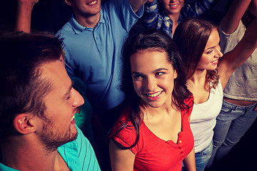 Image showing smiling friends at concert in club