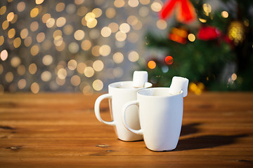 Image showing cups of hot chocolate with marshmallow on wood