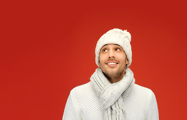 Image showing handsome man in warm sweater, hat and scarf