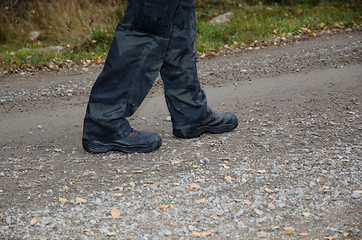 Image showing Walking on a gravel road