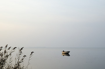 Image showing Lone rowing boat in calm water