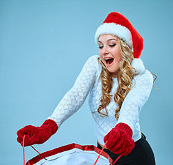 Image showing Beautiful young woman in Santa Claus clothes