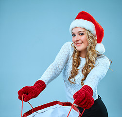 Image showing Beautiful young woman in Santa Claus clothes