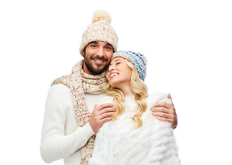 Image showing smiling couple in winter clothes hugging