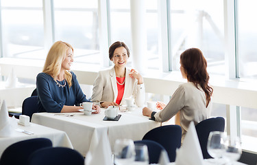 Image showing women drinking coffee and talking at restaurant