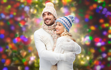 Image showing smiling couple in winter clothes hugging