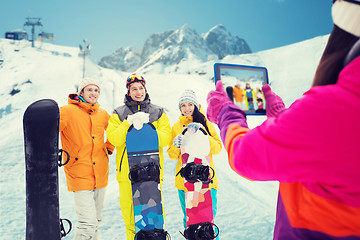 Image showing happy friends with snowboards and tablet pc