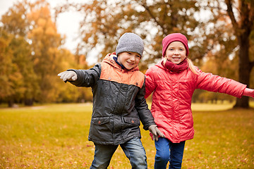 Image showing happy little children running and playing outdoors