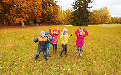 Image showing group of happy children having fun in autumn park