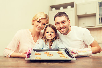 Image showing happy family making cookies at home