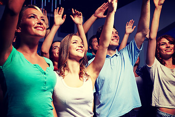 Image showing smiling friends at concert in club