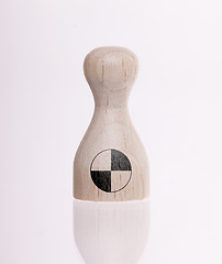 Image showing Wooden pawn with a painting of a flag