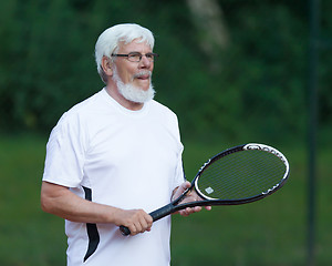 Image showing Senior man playing tennis