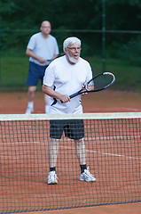 Image showing Senior man playing tennis